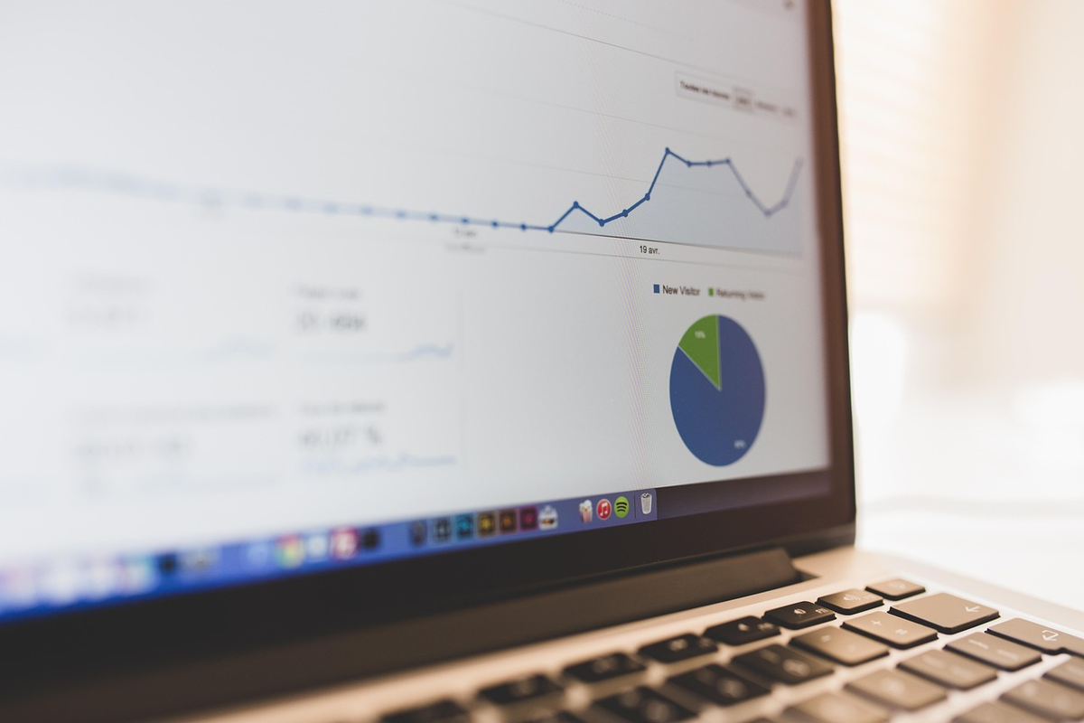 A sophisticated digital interface displays a dynamic blend of financial analysis, with intricate market charts, data points, and economic indicators coalescing to form a clear, upward-trending investment strategy pathway.