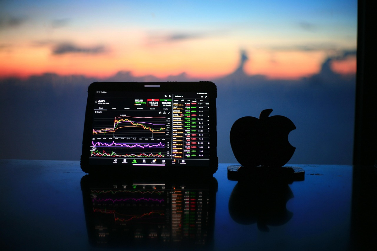 A focused hand interacts with a sleek digital screen displaying vibrant green upward-trending stock charts and diverse financial symbols, set in a modern, well-lit financial environment, symbolizing informed investment decisions and the discovery of top securities accounts and brokers in Lithuania.
