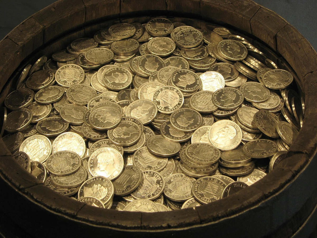 A meticulously arranged stack of polished coins and ascending bar graphs transforming into a stable, illuminated pathway leading towards a distant, prosperous horizon, symbolizing strategic financial management and long-term wealth growth.