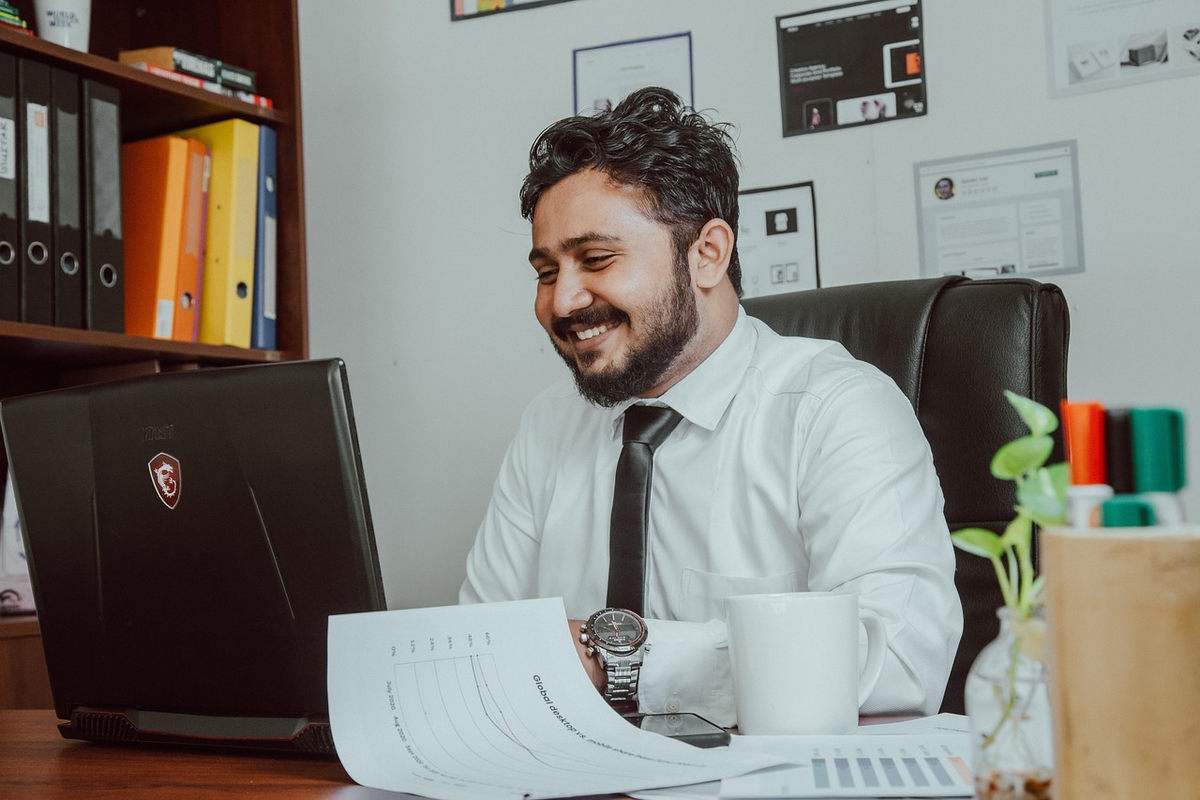 A hand holding a glowing lightbulb over a complex financial ledger, casting clear, organized patterns and insights onto the numbers, symbolizing accounting's role in providing financial clarity and guiding strategic decisions.