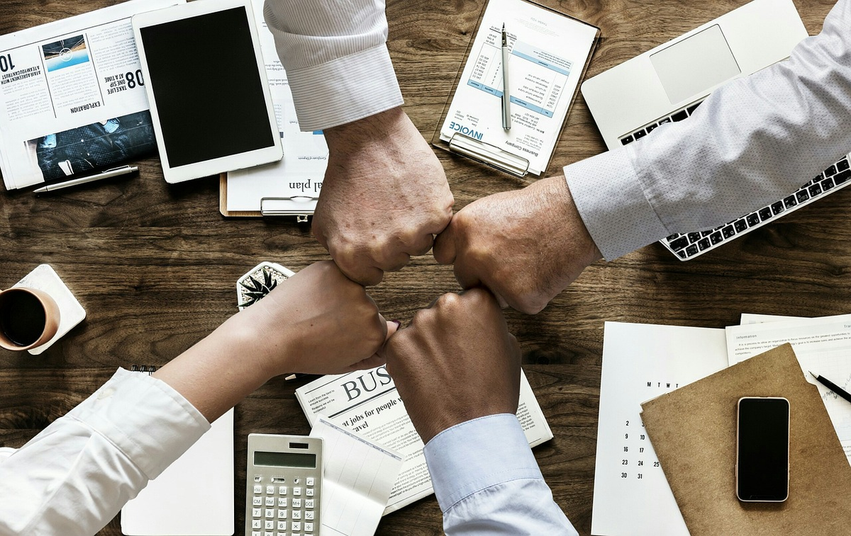 A stylized financial roadmap with an upward trajectory, marked by distinct milestones representing short-term, medium-term, and long-term financial goals, being actively monitored by a focused hand holding a magnifying glass or a stylus.
