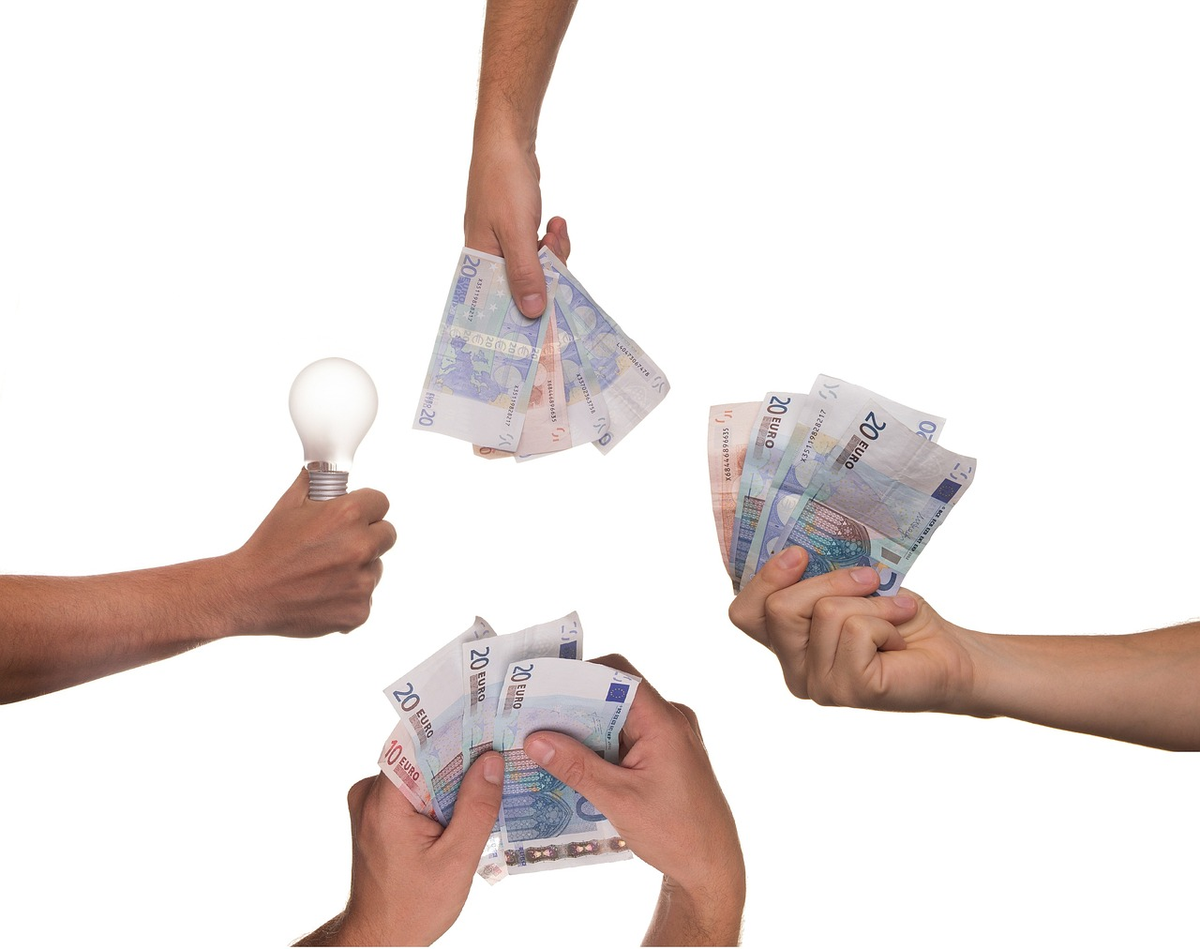 An overhead visual of many diverse hands each contributing a small, distinct financial element (coins, digital symbols, share icons, gift boxes) that collectively flow into a vibrant, emerging project or business at the center, metaphorically bypassing a distant, traditional bank building, embodying crowdfunding.