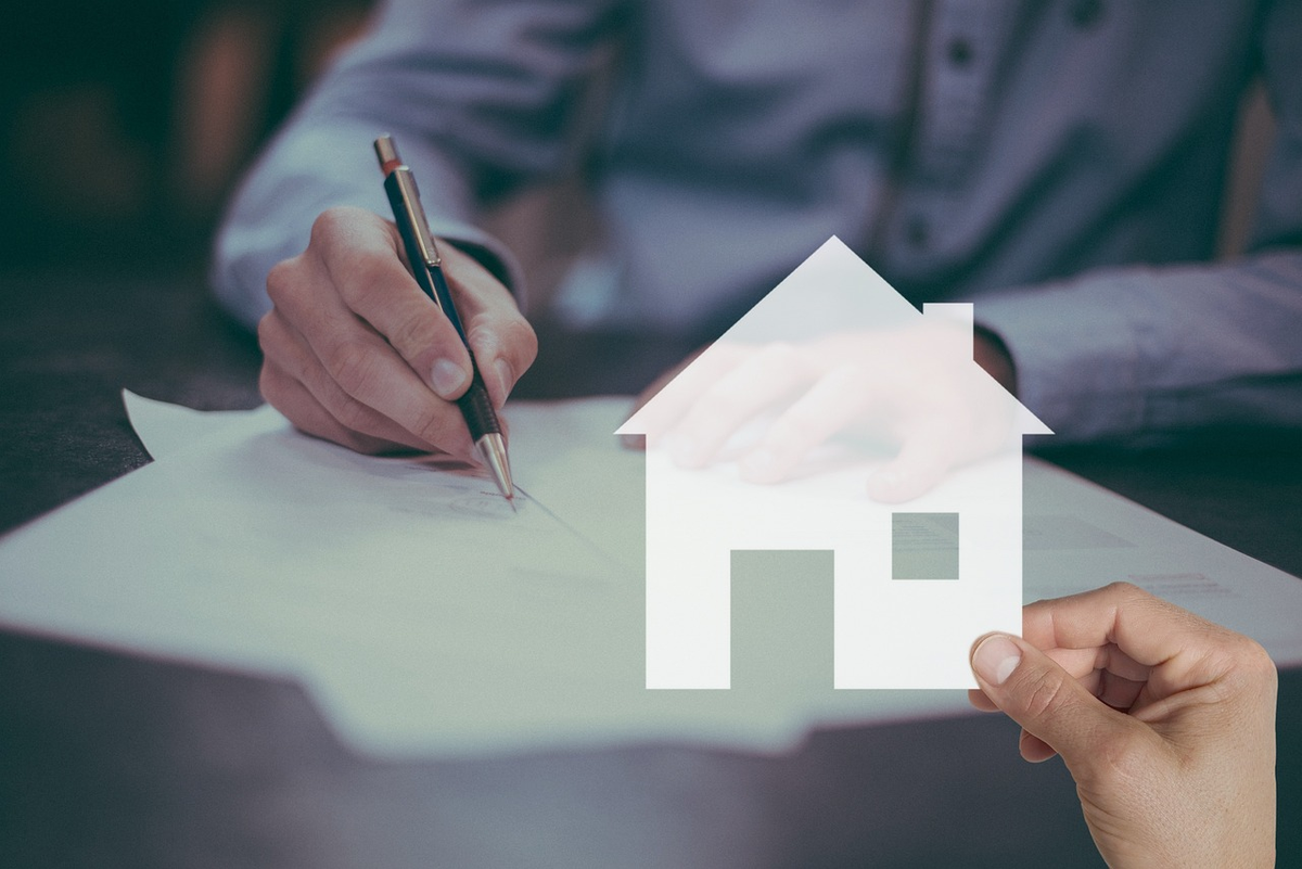 A modern, well-maintained house stands securely, encircled by a translucent protective barrier that deflects stylized symbols of common risks such as fire, water splashes, lightning bolts, and a burglar's mask, illustrating comprehensive multi-risk insurance.