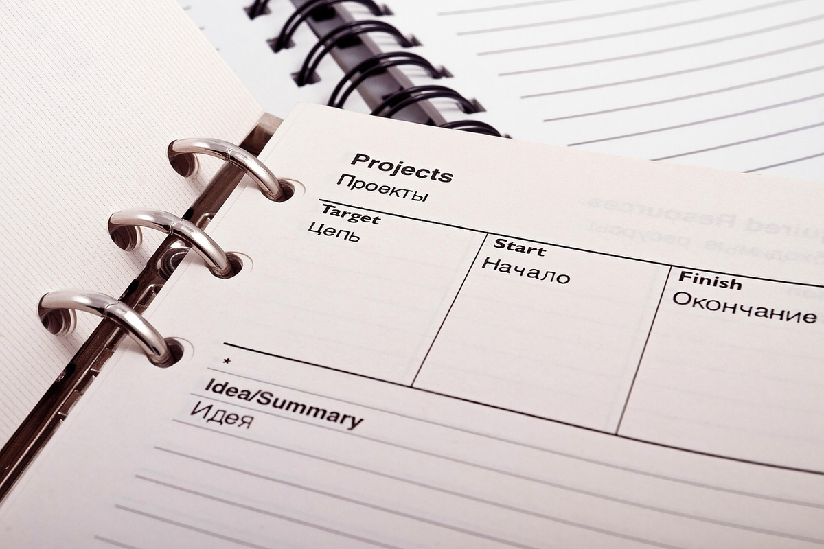 A clean, minimalist desk features a neatly organized stack of financial documents, a simple calculator, and a single, clear line tracing a path directly through them, symbolizing a simplified and straightforward guide to taxes and accounting for small businesses.