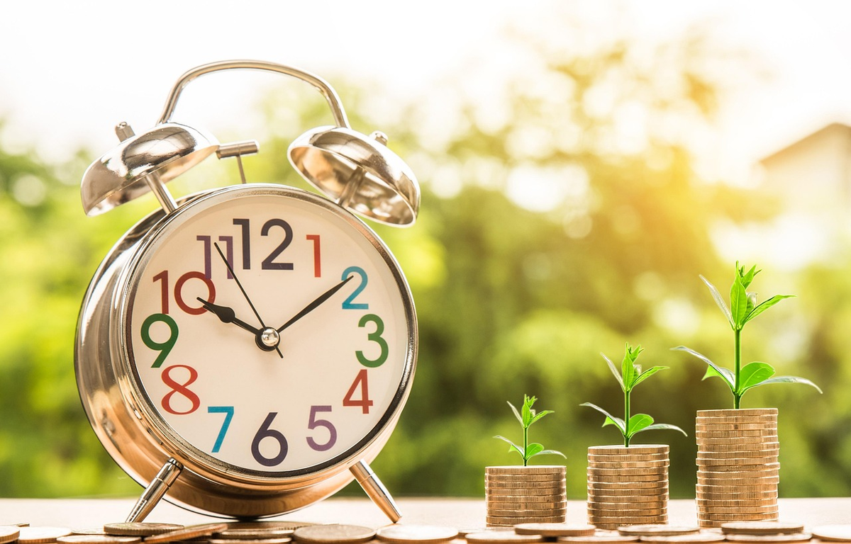 A bright lightbulb illuminating a sturdy base of simplified financial concepts, from which a clear and steady upward-trending growth line emerges, representing the foundational understanding leading to long-term investment benefits.