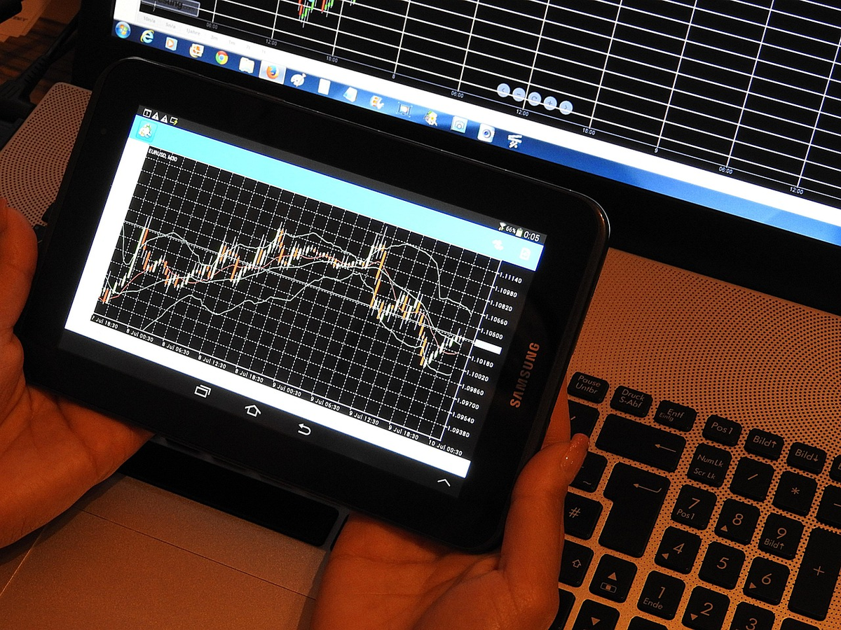 A stylized hand strategically adjusting a glowing, intricate financial dial representing interest rates, with intertwined digital charts in the background illustrating their direct influence on economic growth, inflation, and personal finance elements like loans and savings.