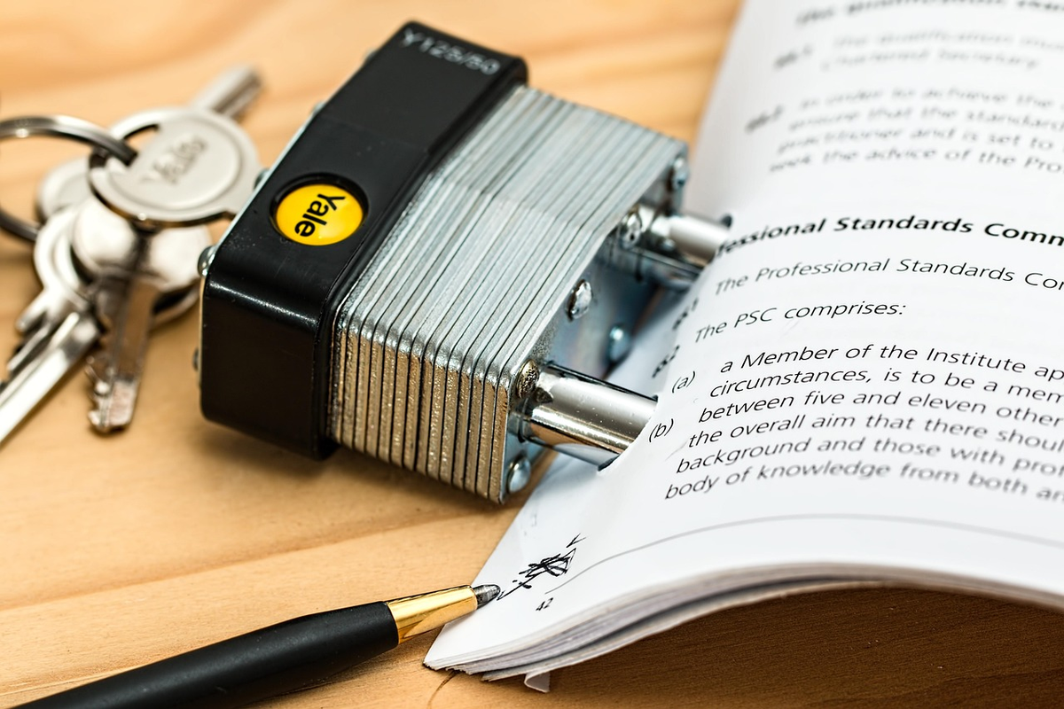 A close-up of a hand holding a magnifying glass over digital financial charts and physical documents, with subtle visual cues of a security shield or a 'checked' mark emerging from the data, symbolizing thorough due diligence and effective risk management in financial decision-making.