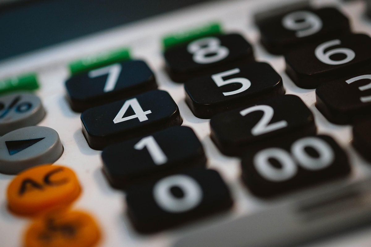 A visually rich composition featuring a person's hands meticulously organizing financial elements like coins, banknotes, and a digital budget displayed on a tablet, subtly incorporating small, abstract tools such as gears or miniature building blocks to symbolize the practical application and construction of financial well-being.