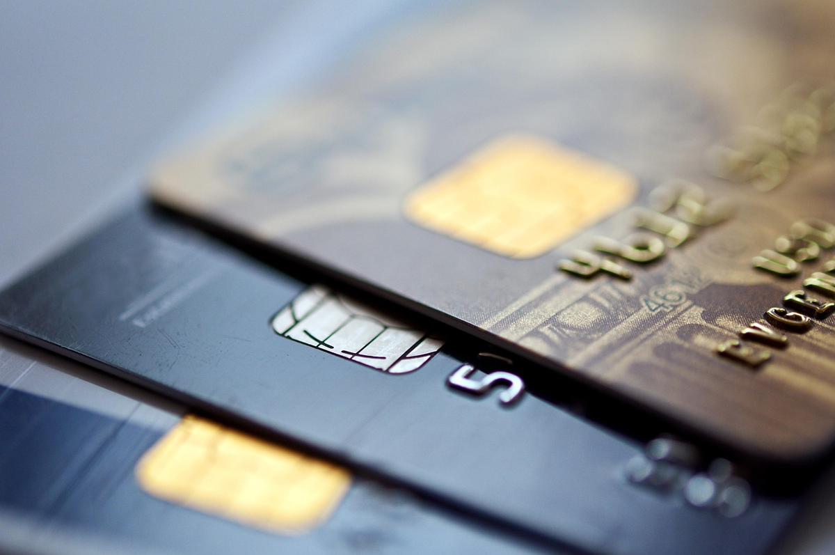 A sophisticated visual of a hand delicately adjusting a pristine, glowing upward-trending financial bar graph, illustrating the meticulous care and continuous effort involved in improving and maintaining a strong credit rating.