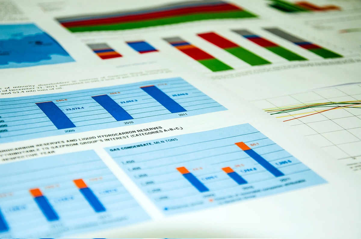 A dynamic financial market graph displayed on a minimalist digital interface, with interconnected visual representations of key economic indicators—like rising bar charts for GDP, expanding bubbles for inflation, and a central adjustable dial for interest rates (EURIBOR)—visibly influencing its upward and downward trends.