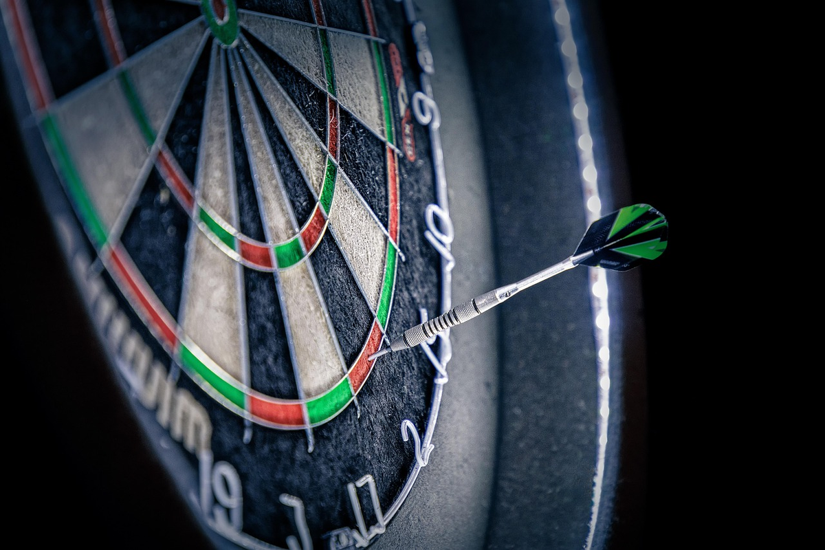 A hand carefully plots a strategic financial course on a detailed map, with clear paths leading to long-term investment goals and indicators for risk, illustrating informed decision-making.