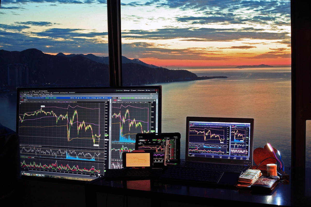 A human hand meticulously assembling a diverse investment portfolio with distinct blocks representing stocks and bonds, placed strategically on an upward-trending financial graph, visually illustrating the application of analysis, diversification, and risk management for optimal financial growth.